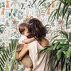 Organisch jungle vliesbehang in zachte groentinten met dierenprint voor een veilig en kindvriendelijk kinderkamerinterieur. - Default Title - Yatsuni Wild | Lilipinso - behang, jungle, kinderkamer, kinderkamer behang, lilipinso, palm, vliesbehang, Yatsuni - Casa Mini